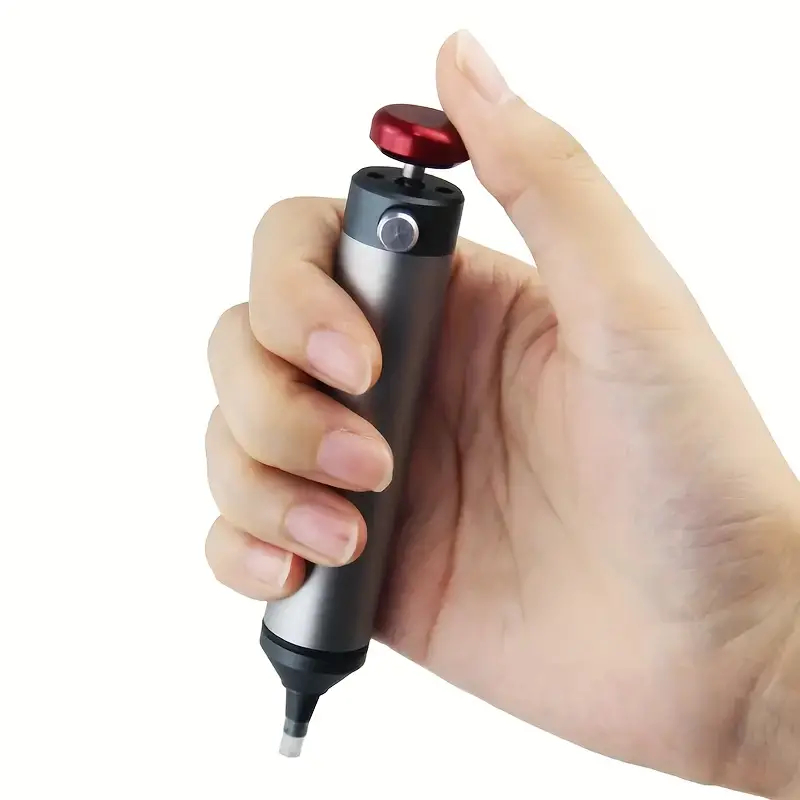 Professionel tinsuger i hånden