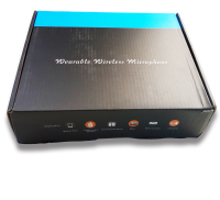 Sort emballageboks med hvidt og orange tekst og ikoner angiver anvendelse med mobiltelefon, aktiv højttalervogn, undervisningsudstyr, mixer, hjemmebiograf, computer. Øverst står 